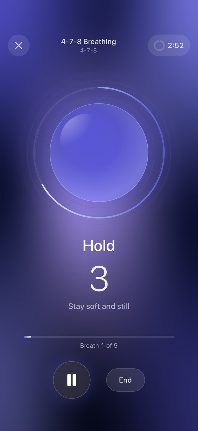 A Breathe Well 4-7-8 session: an indigo orb, the prompt Hold, 3, Stay soft and still, and a progress ring